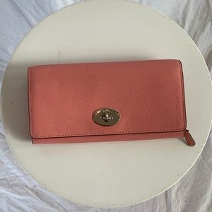 Pink / coral trifold coach wallet